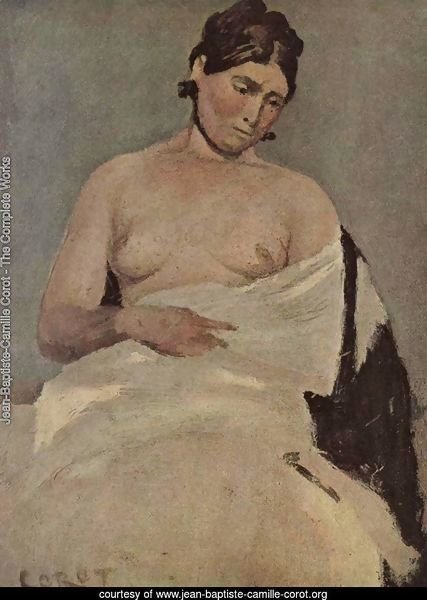 Sitting woman with bare breasts